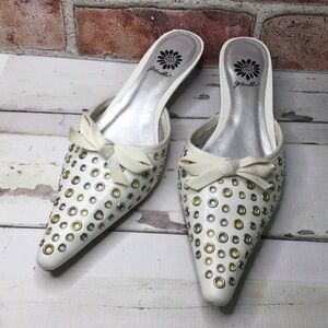 Size 7 Super cute leather and eyelet mules.